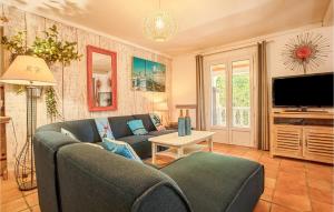 a living room with a couch and a tv at Beautiful Home In Les Arcs With Wifi in Trans-en-Provence