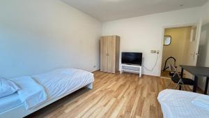 TV a/nebo společenská místnost v ubytování Apartment in Bad Bramstedt ruhige Lage im Haus zur Alleinnutzung mit Parkplatz & WLAN