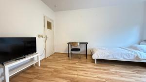 TV a/nebo společenská místnost v ubytování Apartment in Bad Bramstedt ruhige Lage im Haus zur Alleinnutzung mit Parkplatz & WLAN