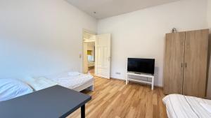 TV a/nebo společenská místnost v ubytování Apartment in Bad Bramstedt ruhige Lage im Haus zur Alleinnutzung mit Parkplatz & WLAN