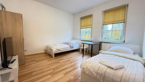 Postel nebo postele na pokoji v ubytování Apartment in Bad Bramstedt ruhige Lage im Haus zur Alleinnutzung mit Parkplatz & WLAN