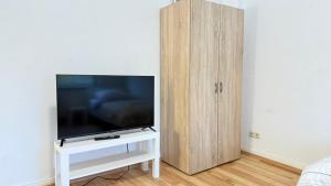 TV a/nebo společenská místnost v ubytování Apartment in Bad Bramstedt ruhige Lage im Haus zur Alleinnutzung mit Parkplatz & WLAN