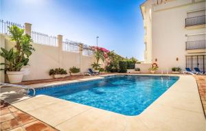a swimming pool in the backyard of a house at 2 Bedroom Lovely Apartment In Marbella in Marbella +19 photos