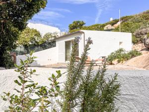 a house on the side of a mountain at Villa Adea in Santa Teresa Gallura