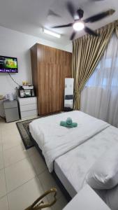 Postel nebo postele na pokoji v ubytování EnL Homestay ALANIS Residence