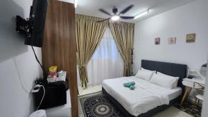 Postel nebo postele na pokoji v ubytování EnL Homestay ALANIS Residence