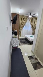 Postel nebo postele na pokoji v ubytování EnL Homestay ALANIS Residence