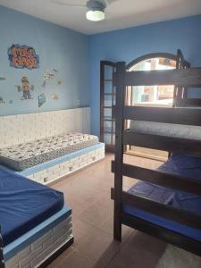 Ένα ή περισσότερα κρεβάτια σε δωμάτιο στο Casa Suarão lazer,espaço área gourmet +26 φωτογραφίες