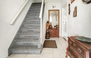 a staircase in a home with a hallway at Stunning Apartment In Vlissingen in Vlissingen