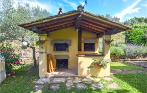 a small yellow house with a roof on top of it at Lovely Home In Cortona With Kitchen in Cortona