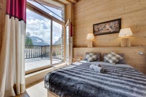Postel nebo postele na pokoji v ubytování CHALET AROLAY
