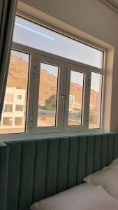 Rúm í herbergi á Sunset hotel
