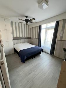 Ένα ή περισσότερα κρεβάτια σε δωμάτιο στο Hotel Breitner