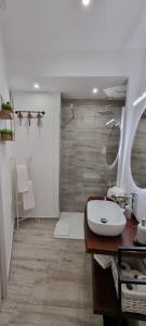 a bathroom with a sink and a mirror at La casa di Agnese in Fiuggi