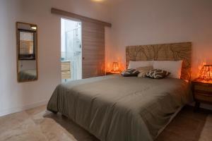 Postel nebo postele na pokoji v ubytování Tamaris et salicorne Résidence de charme