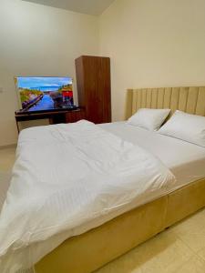 Rúm í herbergi á Sunset hotel