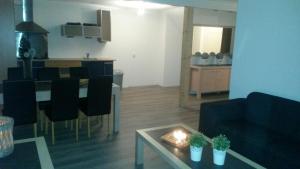 a living room with a table and a dining room at Apartment Vredehof in Sint Maartensbrug