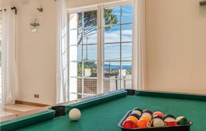 a pool table with balls in a room with a window at Stunning Home In Les Adrets-De-L'estére in Les Adrets de l'Esterel