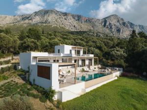 an aerial view of a house with a swimming pool at Villa No Worries - Where Tranquility meets Luxury in Paleros