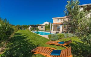 a yard with two chairs and a swimming pool at Villa Corinne in Štuti +22 photos