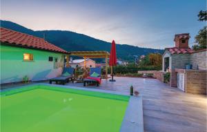 a swimming pool in a backyard with a house at Beautiful Home In Golovik With Wifi in Martina +26 photos