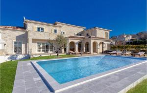 a house with a swimming pool in front of it at Villa Sara in Vranje Selo +34 photos