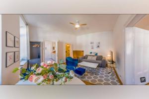 a living room with a bed and a living room with a couch at King's Little Hideout in Budapest