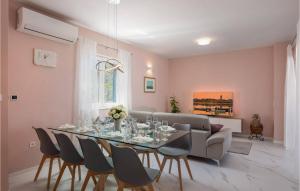 a dining room with a table and chairs at Villa Karla Nin in Nin