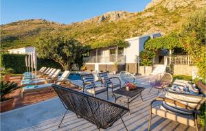 a patio with chairs and a swimming pool at Villa Libertas in Mlini