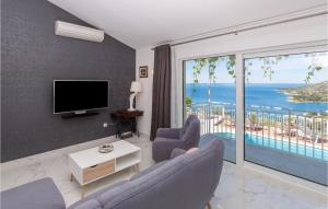 a living room with a view of the ocean at Villa Libertas in Mlini
