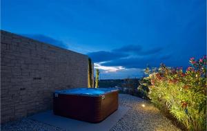 a hot tub sitting next to a brick wall at Villa Terra Bianca in Brtonigla