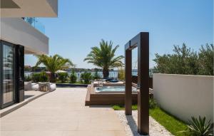 a backyard with a swimming pool and a house at Villa Mowana in Privlaka +25 photos