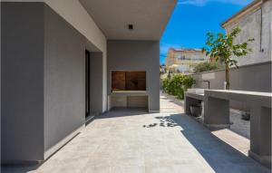 an empty courtyard of a house with a wall at Villa Opal in Zadar +40 photos