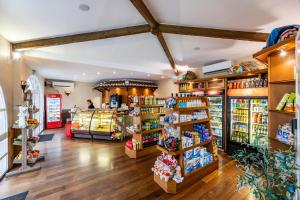 a grocery store with several shelves of products at Ramada Hotel & Suites by Wyndham Costa del Sol in Fuengirola +99 photos