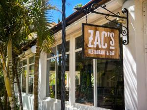 a restaurant sign on the front of a store at Ramada Hotel & Suites by Wyndham Costa del Sol in Fuengirola