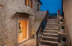 a set of stairs leading up to a building at Villa Kameni Dvori in Sveti Filip i Jakov +41 photos