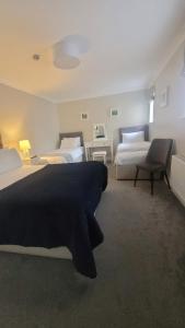 Ένα ή περισσότερα κρεβάτια σε δωμάτιο στο Murphy's Pub and Bed & Breakfast