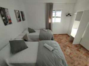 Postel nebo postele na pokoji v ubytování Apartamentos Lucia Algodonales