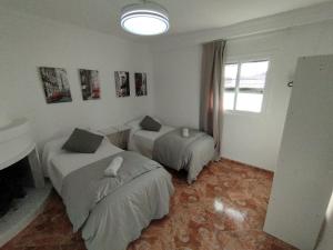 Postel nebo postele na pokoji v ubytování Apartamentos Lucia Algodonales