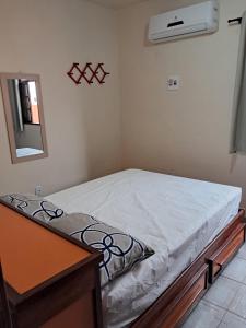 Postel nebo postele na pokoji v ubytování Pontal Hostel Ilhéus
