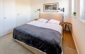 a bedroom with a large bed in a room at Gebirgsresort Winterberg in Winterberg +7 photos