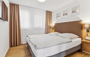 Postel nebo postele na pokoji v ubytování Gebirgsresort Winterberg