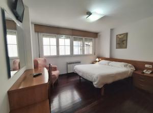 Łóżko lub łóżka w pokoju w obiekcie Hotel Hórreo by Bossh! Hotels