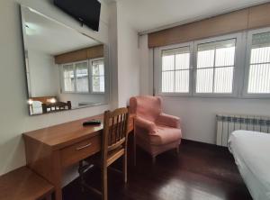 Telewizja i/lub zestaw kina domowego w obiekcie Hotel Hórreo by Bossh! Hotels