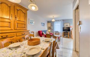 a dining room with a table and a living room at 2 Bedroom Stunning Home In Fécamp in Fécamp