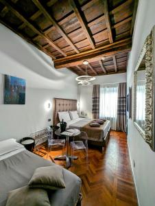 Postel nebo postele na pokoji v ubytování Relais Forus Inn