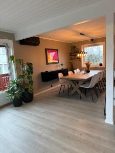 a dining room with a table and chairs at Spacious house near city centre - WSC 2025! in Trondheim