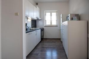 Kuchyň nebo kuchyňský kout v ubytování Apartment Miriam