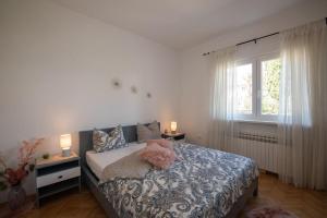 Postel nebo postele na pokoji v ubytování Apartment Miriam