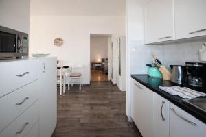 Kuchyň nebo kuchyňský kout v ubytování Apartment Miriam